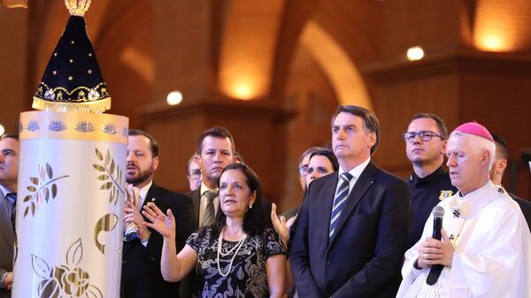 Jair Bolsonaro, presidente do Brasil, durante missa no Santuário Nacional de Nossa Senhora de Aparecida, em Aparecida, São Paulo, em 12 de outubro de 2019 - Sputnik Brasil
