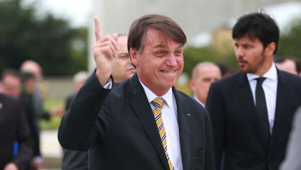 Presidente Jair Bolsonaro participa da Cerimônia do Dia da Bandeira no Palácio do Planalto em Brasília (DF), nesta quinta (19) - Sputnik Brasil