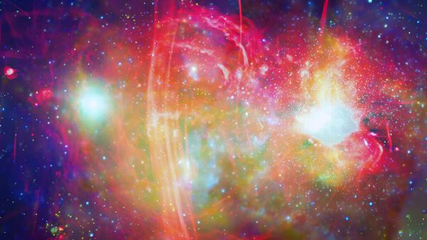 O centro galáctico da Via Láctea, mostrado aqui em ondas de rádio (vermelho) e raios X (verde e azul), tem um buraco negro supermassivo, o Sagitário A*, que pode ter destruído gigantes vermelhas próximas - Sputnik Brasil