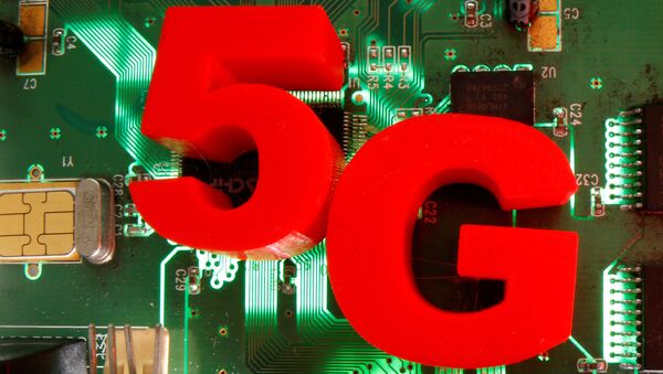 FILE PHOTO: 3d printed objects representing 5G are put on a motherboard in this picture illustration taken April 24, 2020. - Sputnik Brasil
