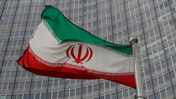 Bandeira do Irã em frente da sede da Agência Internacional de Energia Atômica (AIEA) em Viena, Áustria, 9 de setembro de 2019 - Sputnik Brasil