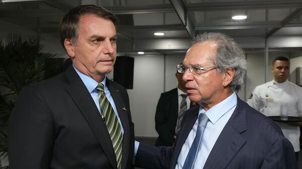 O presidente Jair Bolsonaro e o ministro da Economia Paulo Guedes, em 11 de outubro de 2019 - Sputnik Brasil