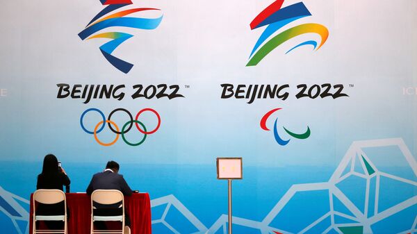 Funcionários dos Jogos Olímpicos de Inverno de 2022 durante evento teste em parque aquático em Pequim, China, 1º de abril de 2021  - Sputnik Brasil