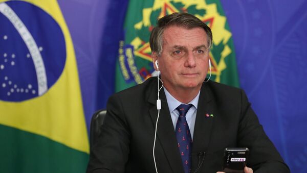 O presidente Jair Bolsonaro em videochamada com o ministro das Comunicações, Fábio Faria, no dia 9 de abril de 2021 - Sputnik Brasil