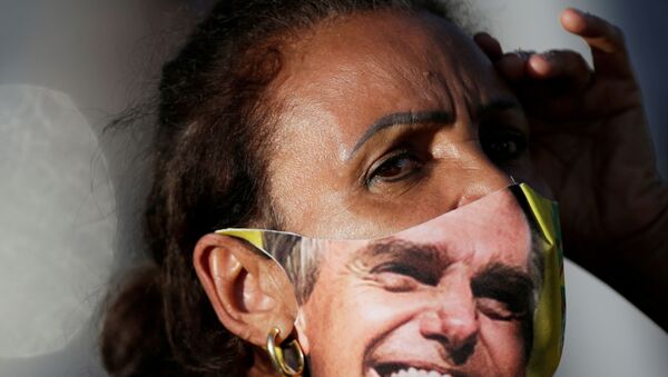 Mulher com máscara durante manifestação de agricultores em apoio ao presidente do país, 15 de maio de 2021 - Sputnik Brasil
