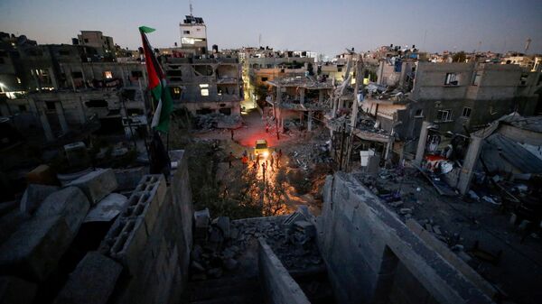 Uma visão geral das casas danificadas que foram destruídas por ataques aéreos israelenses durante os combates Israel-Hamas, na Faixa de Gaza, 23 de maio de 2021 - Sputnik Brasil
