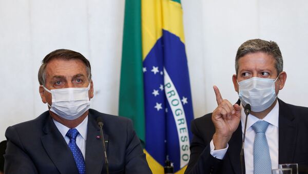 Jair Bolsonaro, presidente do Brasil, e Arthur Lira, presidente da Câmara dos Deputados, participam de reunião em Brasília, Brasil, 9 de agosto de 2021 - Sputnik Brasil