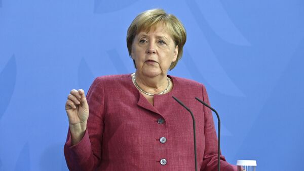 A chanceler alemã, Angela Merkel, dá uma entrevista coletiva após uma cúpula virtual do G7 sobre a crise desencadeada pelo retorno do Talibã ao poder no Afeganistão, na chancelaria em Berlim, 24 de agosto de 2021 - Sputnik Brasil