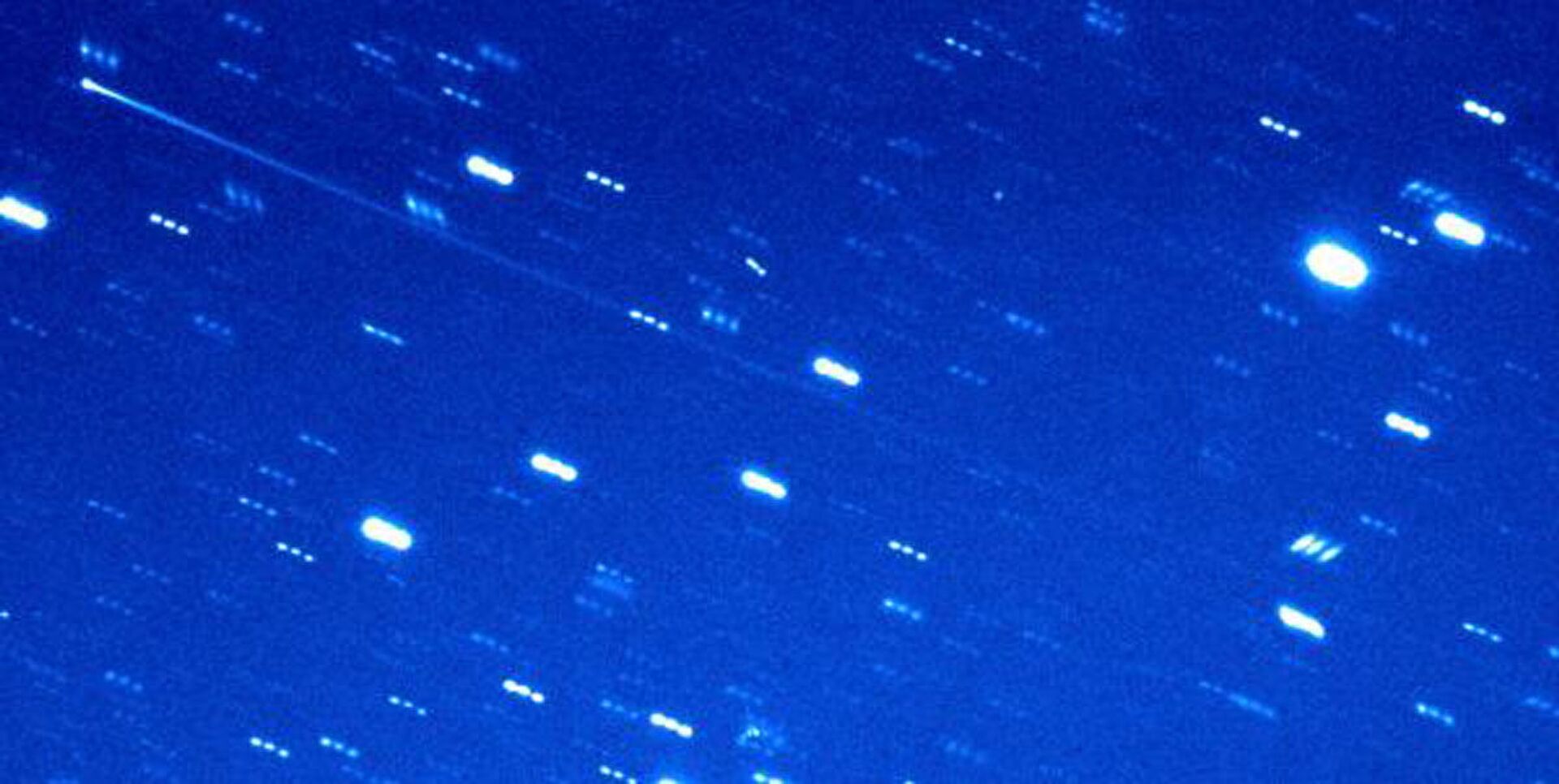 Foto do asteroide-cometa 2005 QN173, tirada pelos telescópios Palomar e o Haleakala - Sputnik Brasil, 1920, 09.11.2021