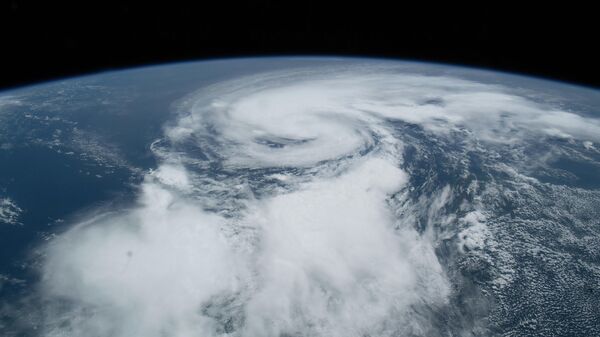 O furacão Henri é retratado na costa leste dos Estados Unidos a partir da Estação Espacial Internacional, orbitando 264 milhas (aproximadamente 425 km) acima de Toronto, Canadá, 21 de agosto de 2021 - Sputnik Brasil