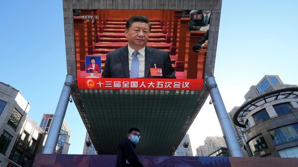 O presidente chinês, Xi Jinping, é visto em transmissão da cerimônia de abertura do Congresso Popular Nacional, em Pequim, 5 de março de 2022 - Sputnik Brasil