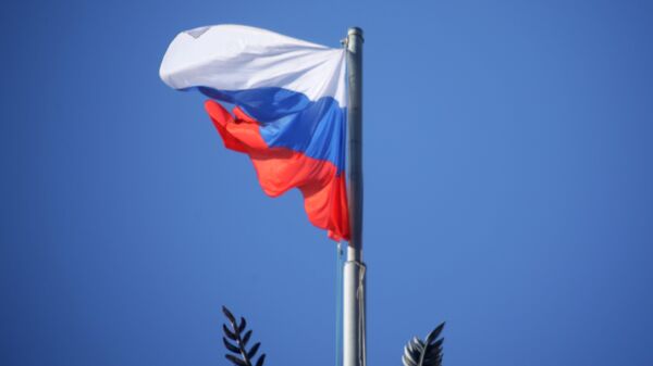 Bandeira russa no prédio do Ministério da Defesa russo em Moscou (foto de arquivo). - Sputnik Brasil