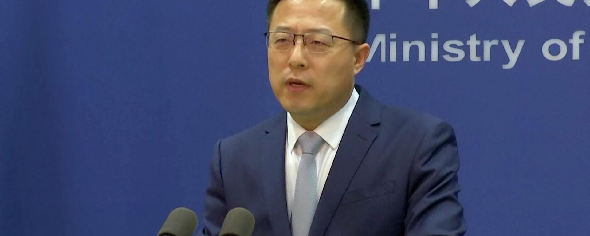 Zhao Lijian, porta-voz do Ministério das Relações Exteriores chinês, fala durante briefing de imprensa em 10 de março de 2022, Pequim, China - Sputnik Brasil, 1920, 07.06.2022