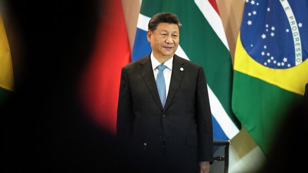 O presidente da China, Xi Jinping, chega a uma reunião com membros do Conselho Empresarial e membros da gestão do Novo Banco de Desenvolvimento, durante a cúpula do BRICS em Brasília, 14 de novembro de 2019 - Sputnik Brasil