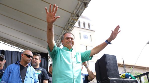 Candidato à reeleição, o presidente Jair Bolsonaro (PL) durante campanha política na cidade de Divinópolis, em Minas Gerais, em 23 de setembro de 2022 (foto de arquivo) - Sputnik Brasil