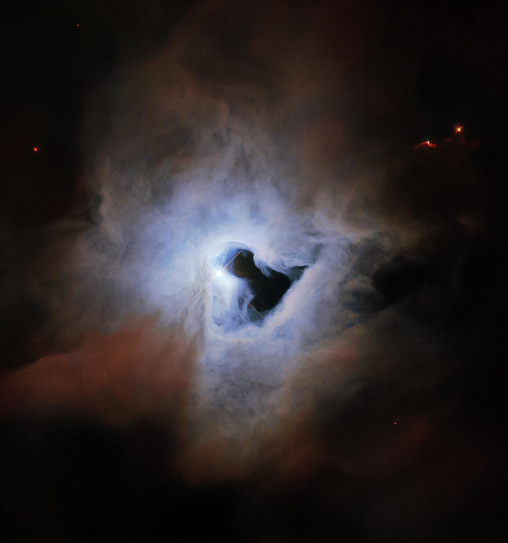 O Telescópio Espacial Hubble flagrou a nebulosa de reflexão NGC 1999 na constelação de Órion, a 1.350 anos-luz de distância da Terra - Sputnik Brasil, 1920, 24.10.2022