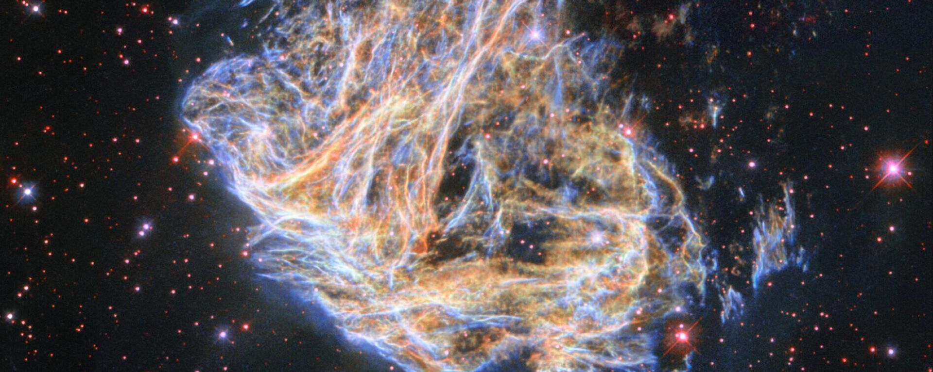 O Telescópio Espacial Hubble da NASA registrou os fragmentos da remanescente de supernova colorida DEM L 190 - Sputnik Brasil, 1920, 17.10.2023