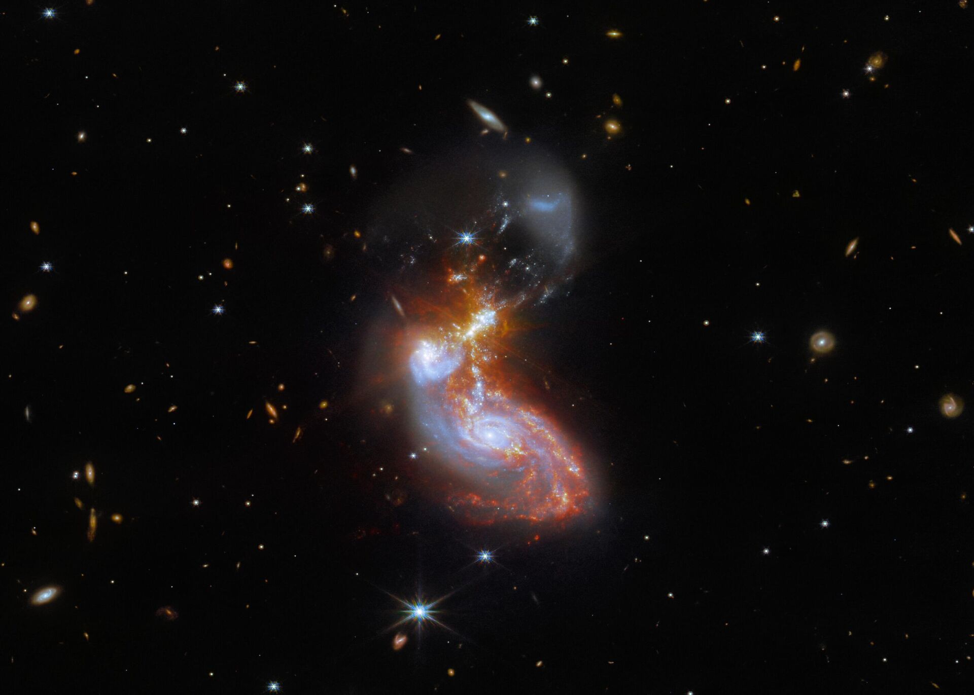A dupla de galáxias, conhecida como II ZW 96, está a aproximadamente 500 milhões de anos-luz da Terra, na constelação do Golfinho - Sputnik Brasil, 1920, 01.12.2022