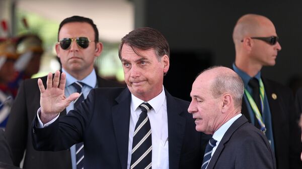 Jair Bolsonaro deixa o Ministério da Defesa após almoço com ministros de seu governo, em Brasília (DF), em 14 de janeiro de 2019 - Sputnik Brasil