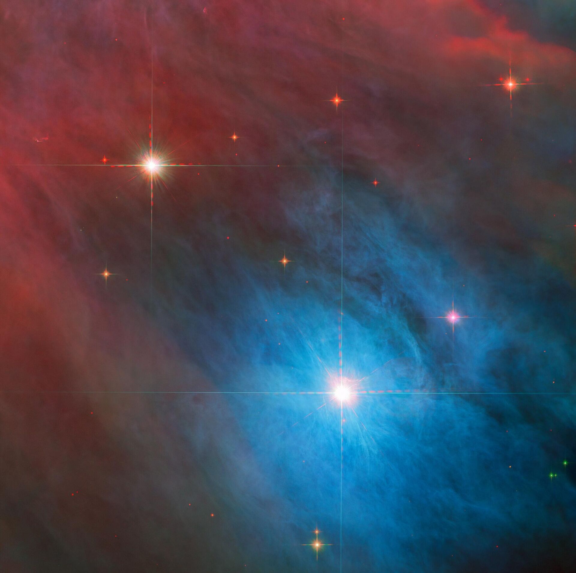 O brilho da estrela V 372 Orionis no centro da imagem captada pelo Telescópio Espacial Hubble é visto acompanhado de uma estrela menor no canto superior esquerdo - Sputnik Brasil, 1920, 23.01.2023