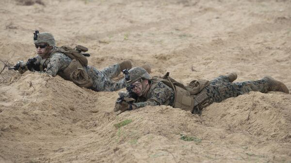 Soldados ocupam suas posições após pousar na cabeça de ponte durante o exercício militar conjunto EUA-Tailandês intitulado: Cobra Gold na praia de Hat Yao, na província de Chonburi, leste da Tailândia (foto de arquivo) - Sputnik Brasil