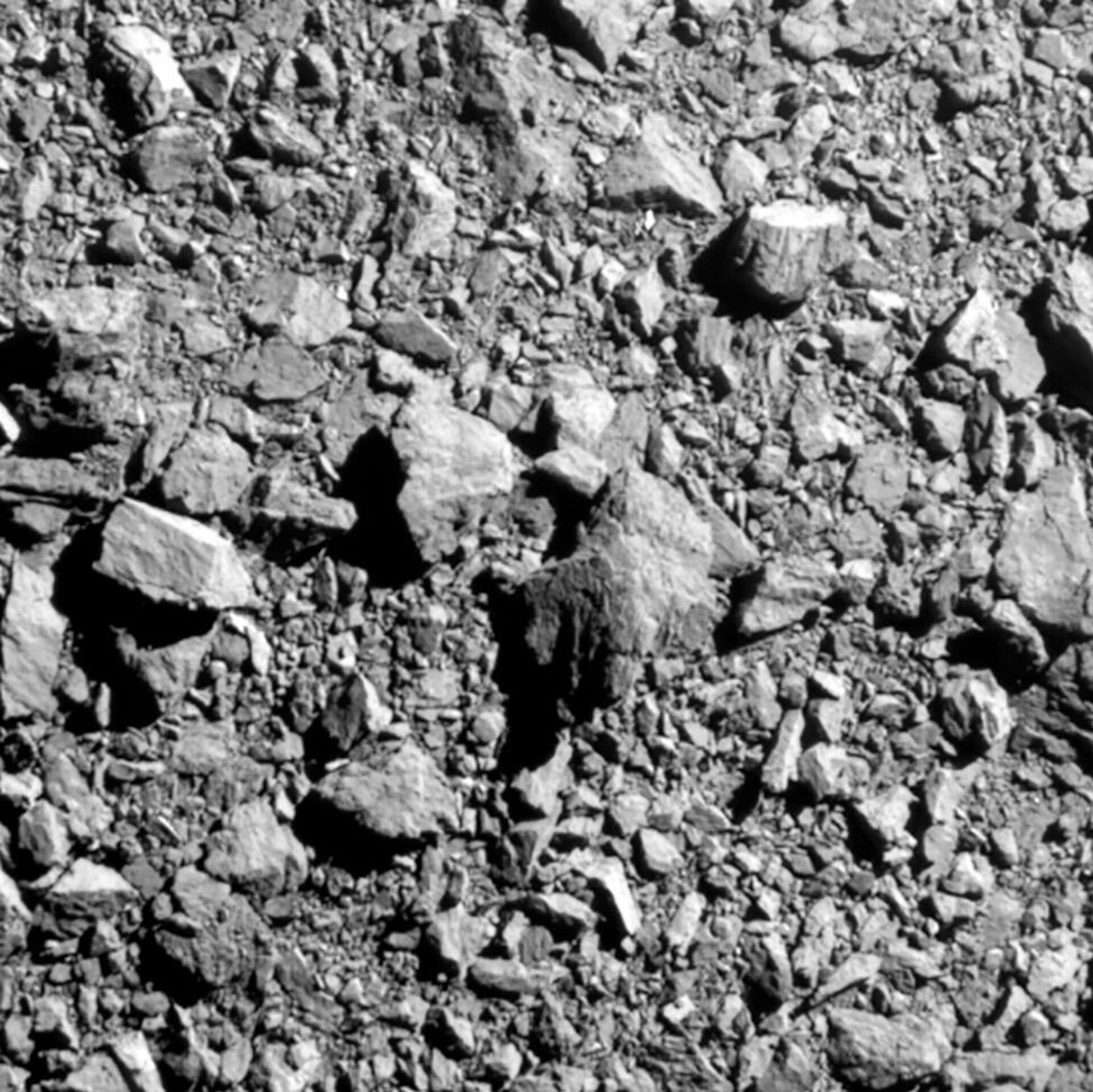 Imagem de alta resolução do asteroide Dimorphos criada com imagens tiradas pelo DART (Teste de Redirecionamento de Asteroide Duplo, na sigla em inglês) durante seu trajeto em direção à superfície do asteroide - Sputnik Brasil, 1920, 21.07.2023