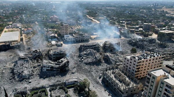 Prédios destruídos na cidade de Al-Zahra, Faixa de Gaza, em 20 de outubro de 2023, após bombardeio israelense durante a noite, em meio aos combates contínuos entre Israel e o grupo palestino Hamas - Sputnik Brasil