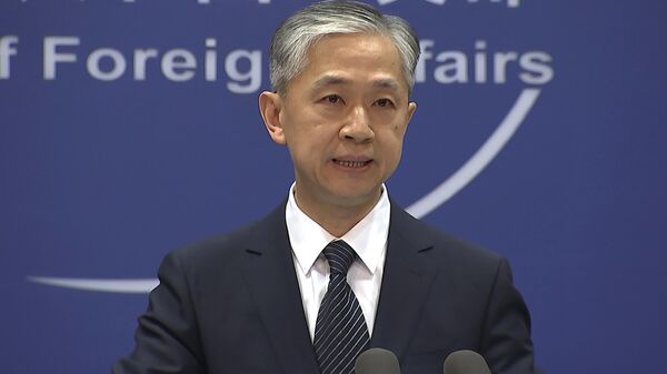 O porta-voz do Ministério das Relações Exteriores da China Wang Wenbin fala durante o briefing diário em Pequim, em 11 de junho de 2021 - Sputnik Brasil