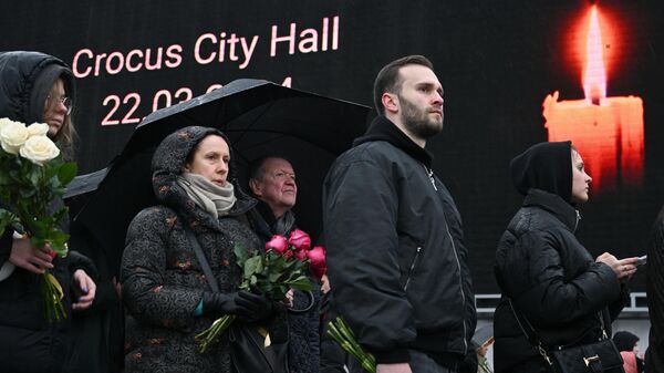 Ação em homenagem às vítimas do ataque terrorista contra o teatro Crocus City Hall, na região de Moscou, Rússia, 24 de março de 2024 - Sputnik Brasil