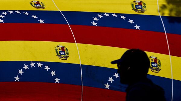 Bandeira nacional venezuelana durante comício em apoio ao governo de Nicolás Maduro, em Caracas, em 23 de janeiro de 2024 - Sputnik Brasil