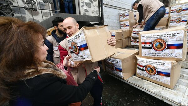 Distribuição da ajuda humanitária de várias comunidades religiosas da Rússia em Damasco - Sputnik Brasil