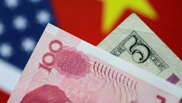 U.S. Dollar and China Yuan notes are seen in this picture illustration June 2, 2017 - Sputnik Brasil
