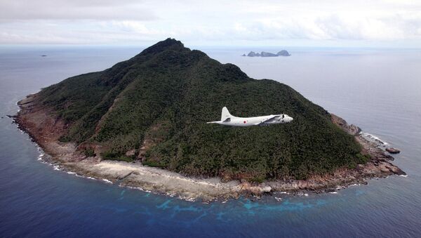 Avião de patrulha P-3C da Força de Autodefesa Marítima do Japão voando na área do mar da China Oriental - Sputnik Brasil