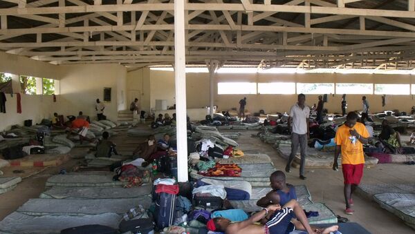 O governo do Acre afirma não ter condições para lidar sozinho com a crise na cidade de Brasileia, principal ponto de entrada de haitianos que vêm ao Brasil sem visto. - Sputnik Brasil