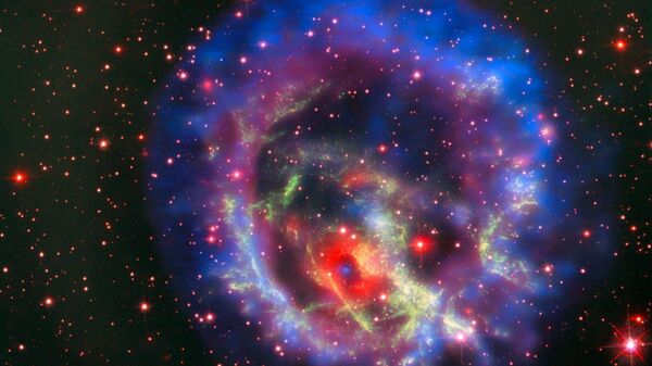 Остатки сверхновой 1E 0102.2-7219, расположенной в ближайшей к нам галактике Малое Магелланово Облако - Sputnik Brasil