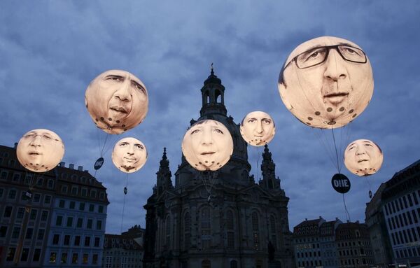 Balões com rostos de líderes dos países-membros do G7 perto da catedral de Frauenkirche, Dresde, em 27 de maio, dia da cúpula dos ministros das Finanças e chefes dos Bancos Centrais dos G7. - Sputnik Brasil