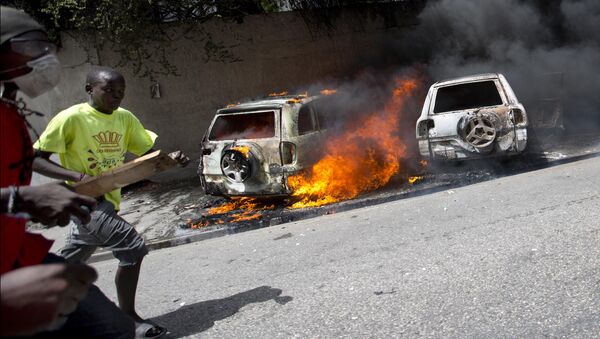 Protesto contra o aumento do preço dos combustíveis no Haiti, em julho de 2018. - Sputnik Brasil