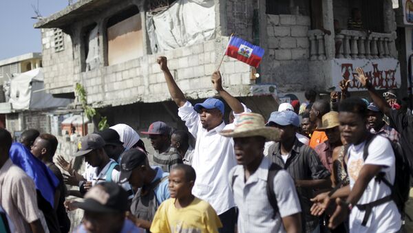 Manifestantes marcham em protesto contra o governo em Porto Príncipe (foto de arquivo). - Sputnik Brasil