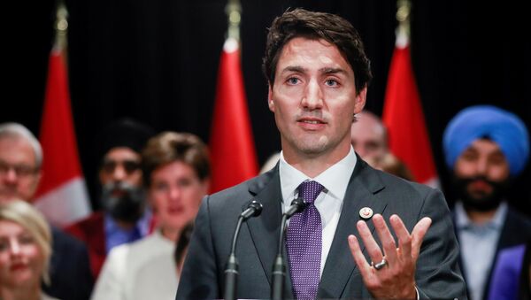 O primeiro-ministro do Canadá, Justin Trudeau, fala à mídia na cidade canadenese de Calgary, em 2017. - Sputnik Brasil