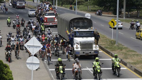 Pessoas acompanham ajuda humanitária dos EUA destinada à Venezuela, em Cucuta, Colômbia, 23 de fevereiro de 2019 - Sputnik Brasil