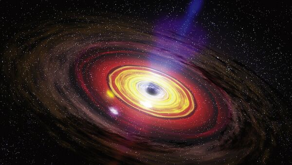 Buracos negros supermassivos, o maior tipo de buraco negro, são normalmente encontrados no centro de grandes galáxias. - Sputnik Brasil