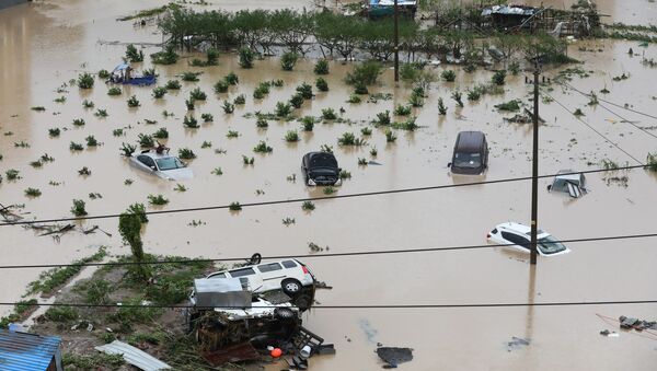 Carros parcialmente submersos após passagem do tufão Lekima na província de Zhejiang - Sputnik Brasil