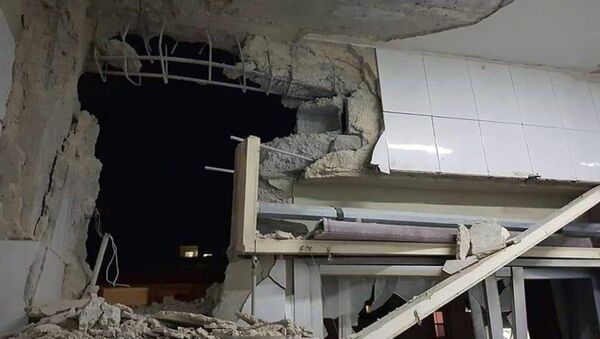 Foto publicada pela agência de notícias síria SANA mostra edifício danificado por ataque aéreo israelense, em Damasco, na Síria, em 20 de novembro de 2019 - Sputnik Brasil