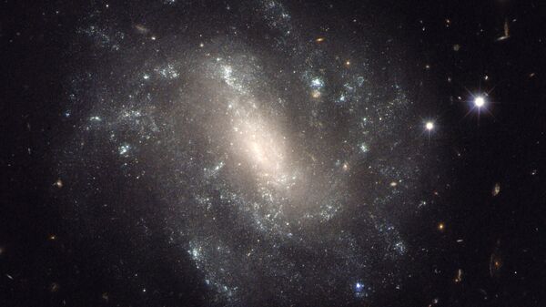 Foto provida pela NASA demonstra galáxia espiral barrada (imagem referencial) - Sputnik Brasil