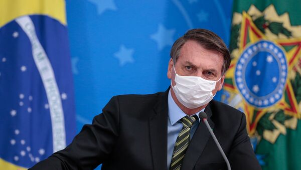 Presidente Jair Bolsonaro durante coletiva de imprensa sobre o novo coronavírus - Sputnik Brasil