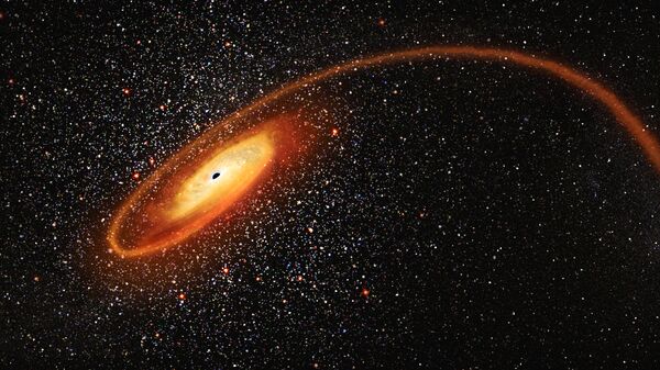 Imagem artística mostra estrela absorvida por um buraco negro - Sputnik Brasil