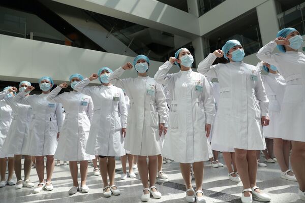 Enfermeiras chinesas durante evento no Dia Internacional das Enfermeiras em um hospital, na China - Sputnik Brasil