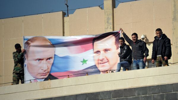 Al-Baath University students hold a rally in Homs in support of Russia's military operation in Syria - Sputnik Brasil