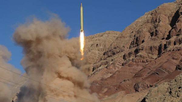 A long-range Qadr ballistic missile is launched in the Alborz mountain range in northern Iran on March 9, 2016. (File) - Sputnik Brasil