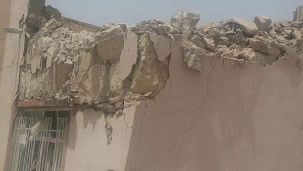 Inferno no Iraque: prédios destruídos por foguetes Jhannam, de fabrico terrorista, na cidade de el-Khaldiya, na província de Anbar, em 16 de maio de 2016 - Sputnik Brasil